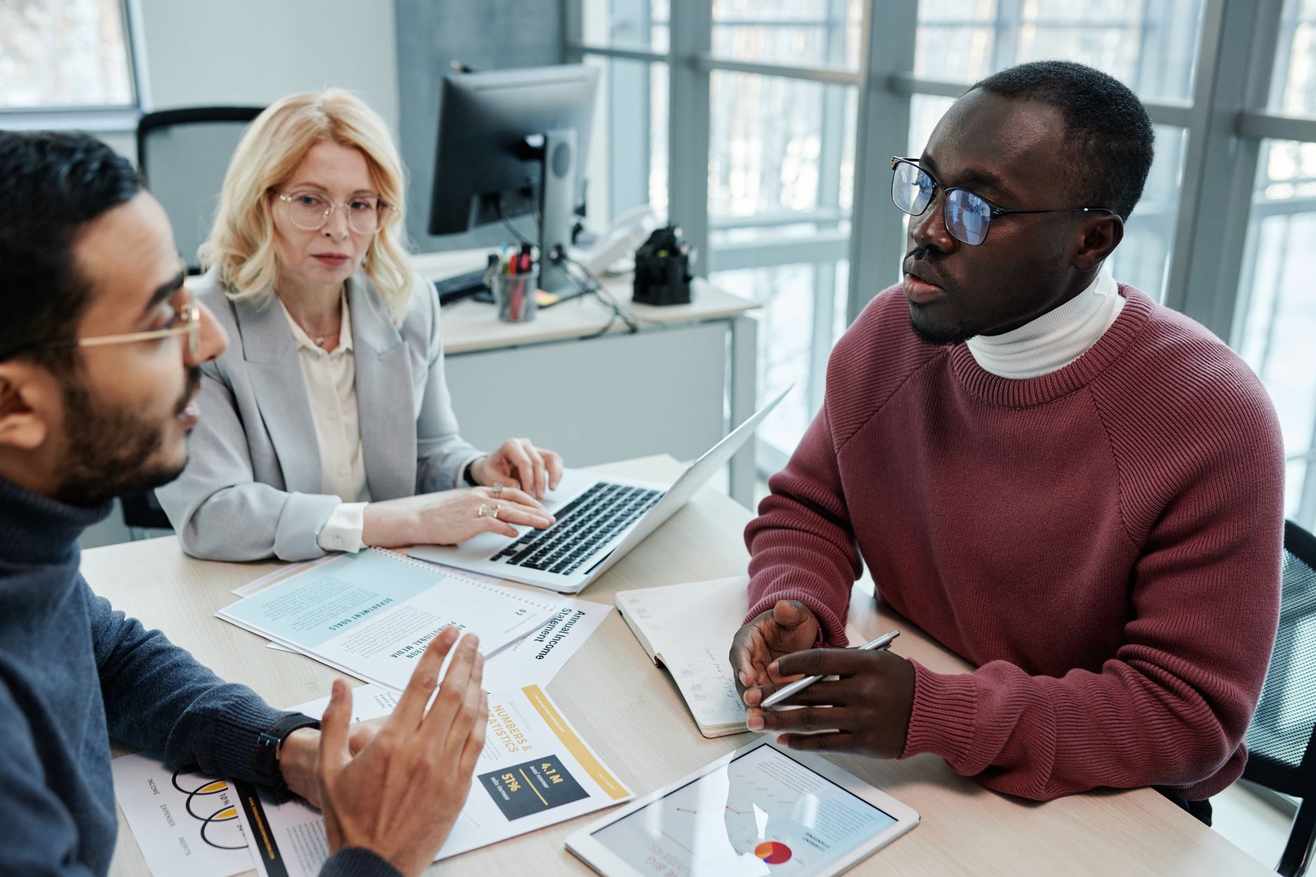 diverse business team discussing insurance