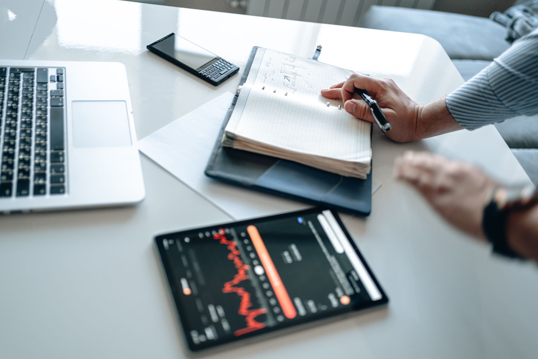 modern office desk with laptop and smartphone, business growth