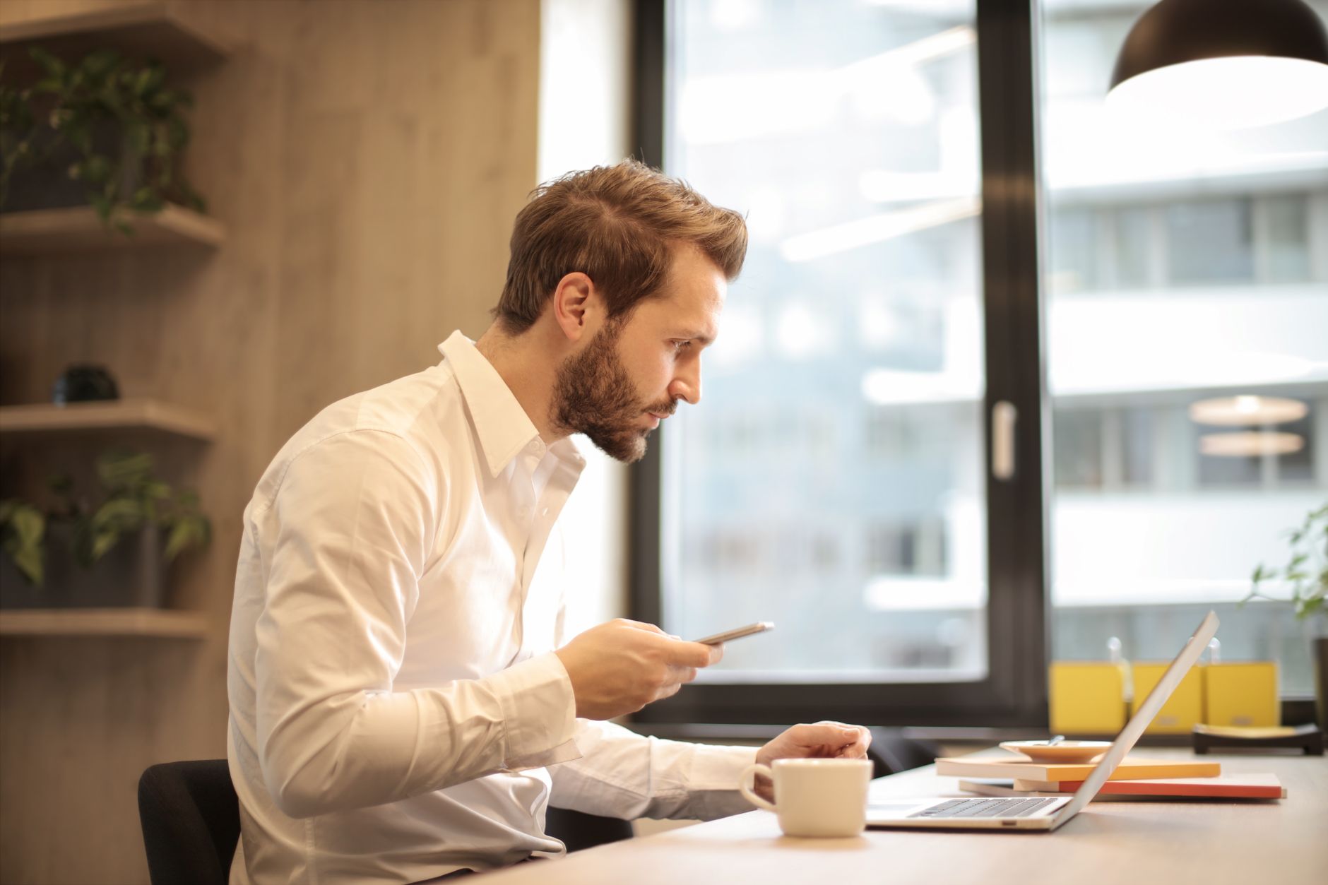 person comparing services on laptop, decision making