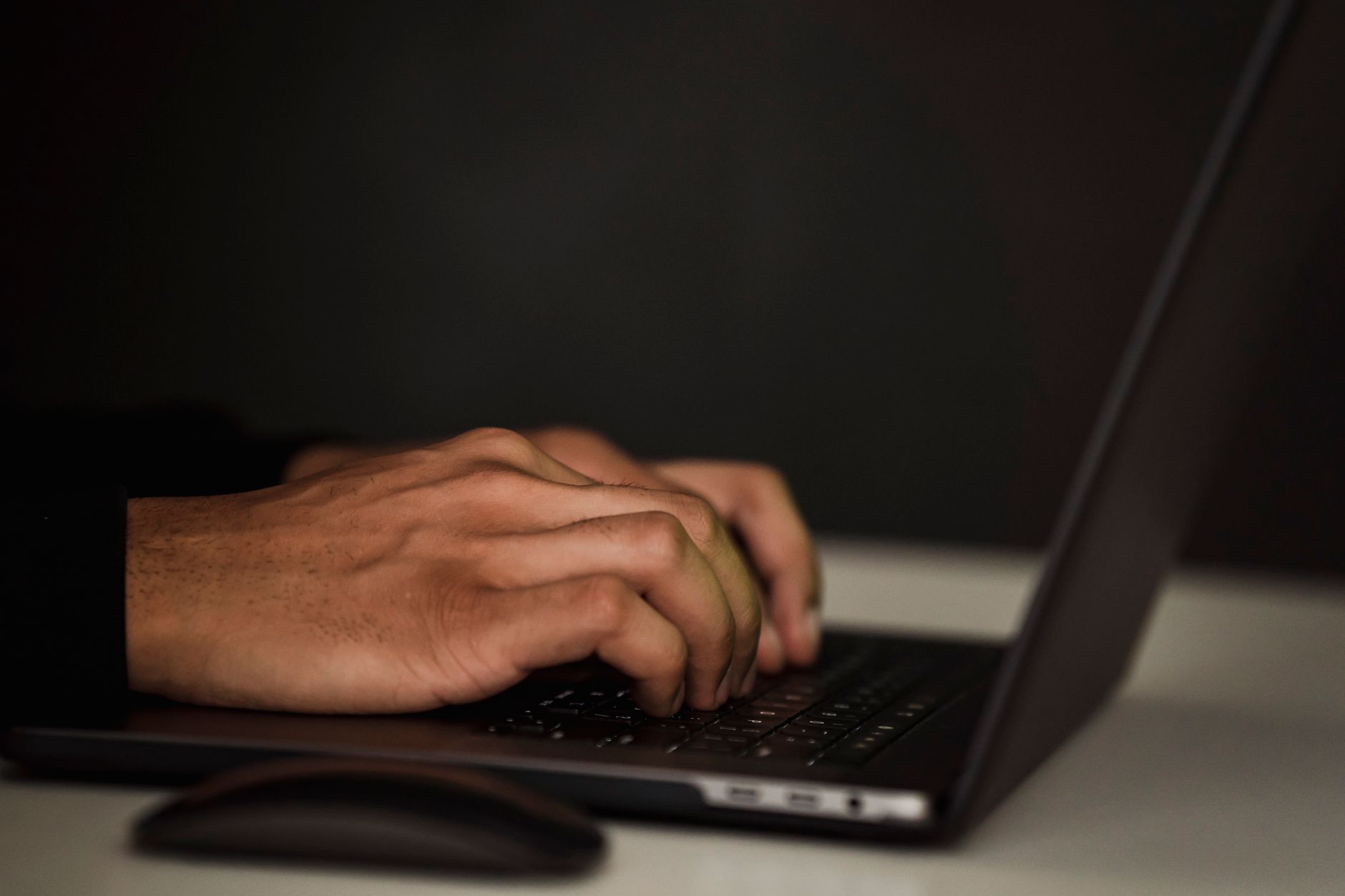 person reading online reviews on laptop, close up