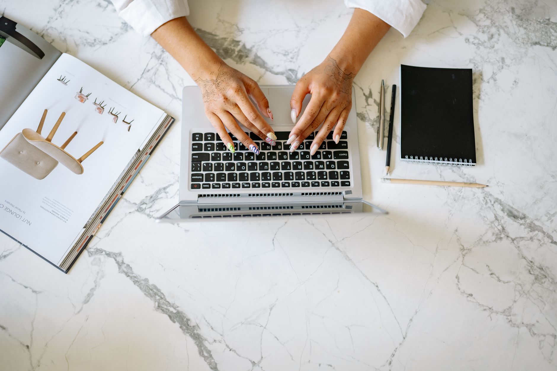 person using laptop managing property booking