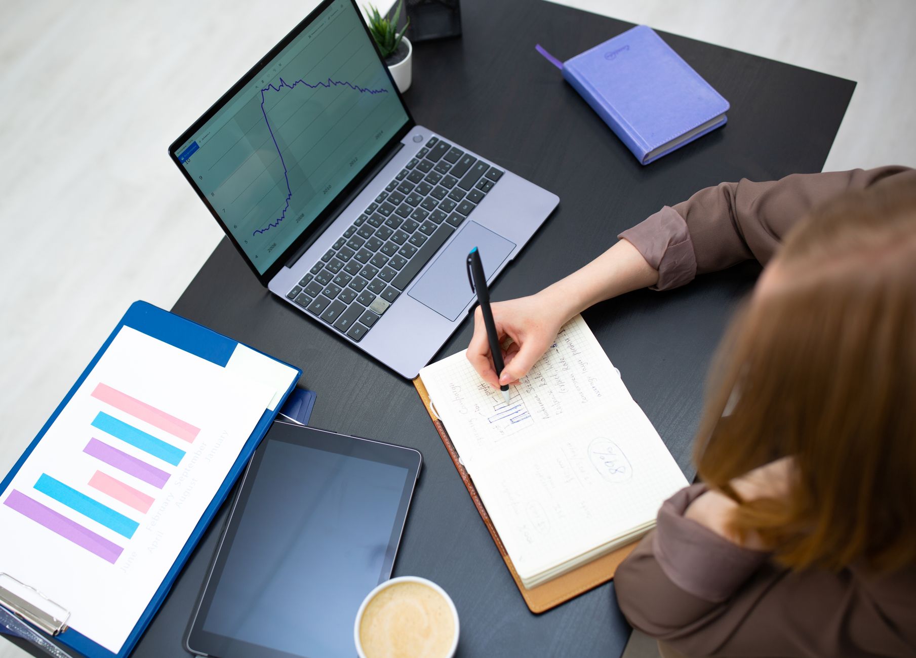 professional woman organizing schedule on tablet