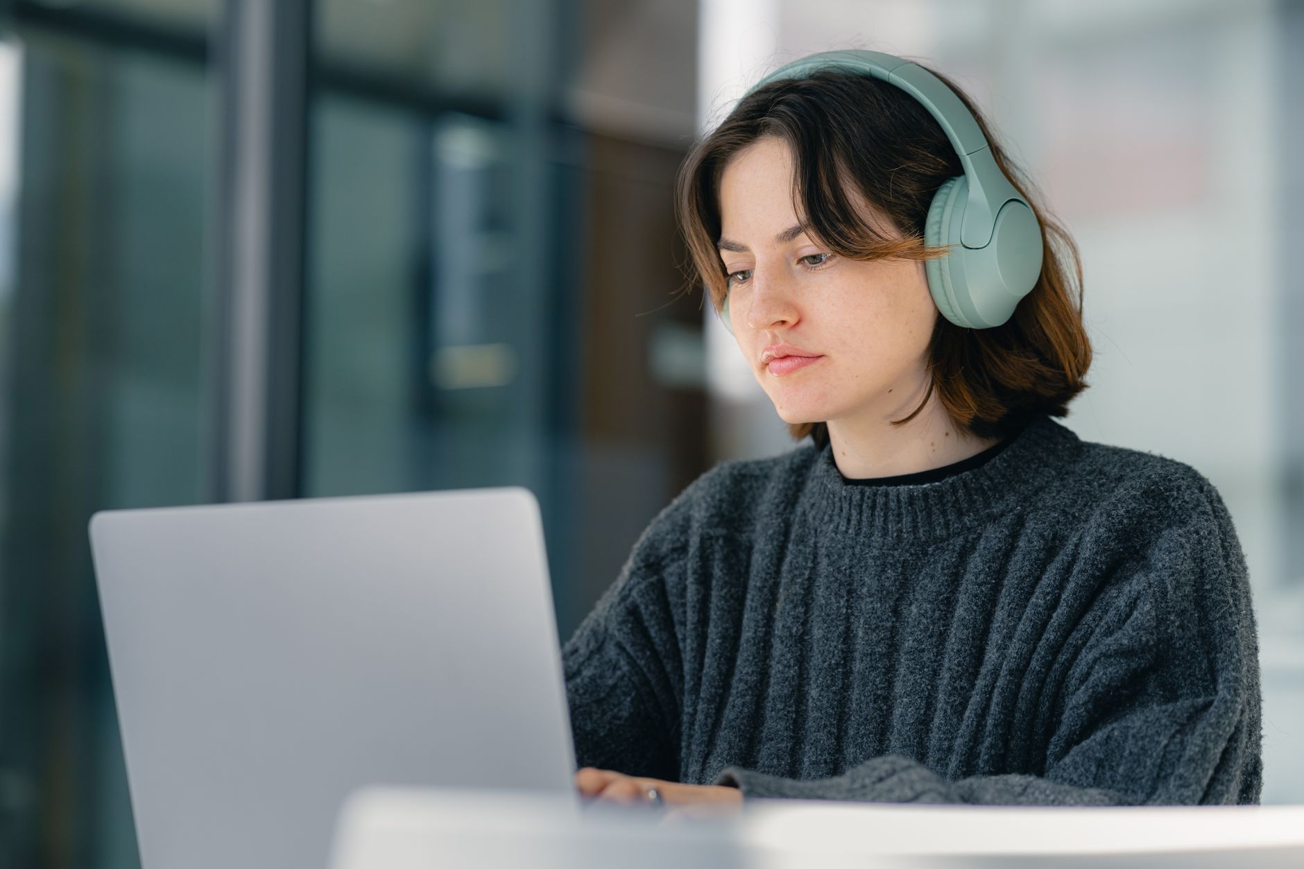student using laptop at desk